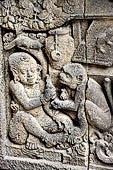 Prambanan - Ramayana reliefs of Shiva Temple. Detail of the panel of the rape of Sita by Rawana, disguised as a begging Brahman.  